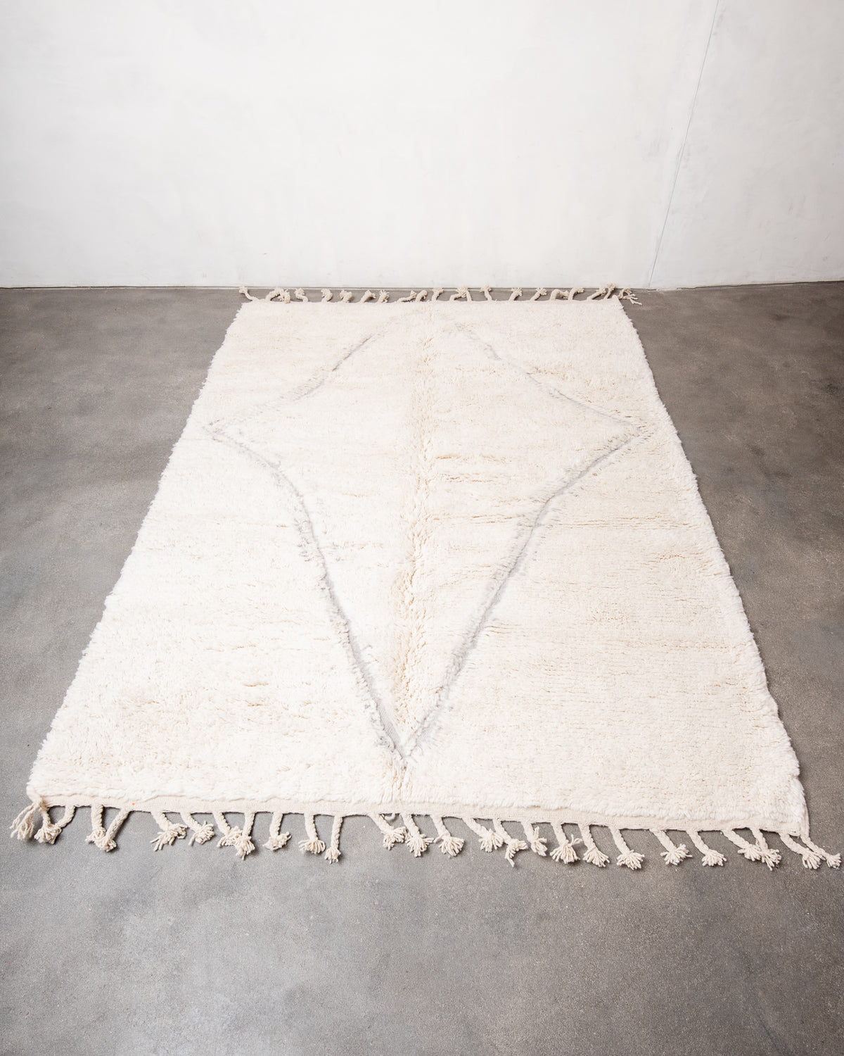 Modern, designer, handcrafted Berber rug from Morocco. Beniourain carpet with minimalist design, natural wool pile and a fluffy texture.